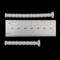 alt="set of two resin power cables shown next to a ruler, the longer cable measures 75 millimetres and the shorter 52 millimetres"