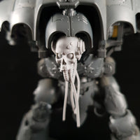 alt="imperial knight skull head assembled with cables hanging loose, pictured on an imperial knight"