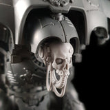 alt="imperial knight skull head with cables looped up, assembled on an imperial knight. Shown looking to the left in a focused view showing the orb like eyes"