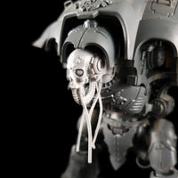 alt="imperial knight skull head assembled with cables hanging loose, pictured on an imperial knight view from the left"