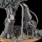 alt="chain link chain on an imperial knight valiant, hanging down from the harpoon into a pile on the floor"