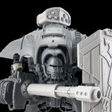 alt="imperial knight extermination cannon shown posed on an imperial knight, firing through the fire slots of a breach shield"