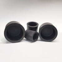 alt="four round black plinths shown on their sides to demonstrate to hollow design, pictured against a white background"