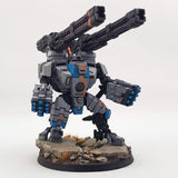 alt="tau broadside battlesuit railgun assembled and painted in a grey and blue scheme on a broadside model along with missile arms"