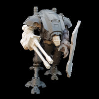 alt="imperial knight armiger model kit assembled with fist, shield and duel barrel auto-cannon. Shown from the right as it looks to its left ready to fire"